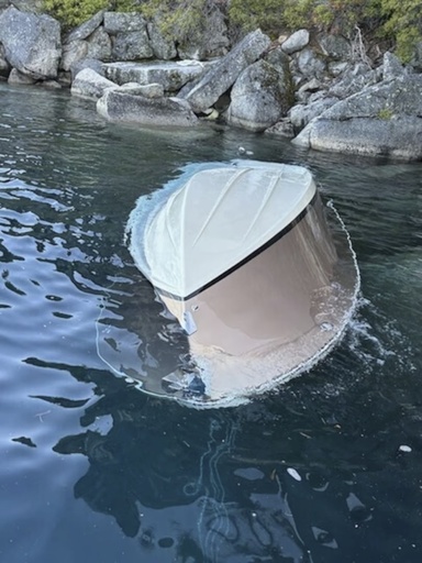 In the photo released by the U.S. Coast Guard, a capsized vessel floats is seen near D.L. Bliss State Park at Lake Tahoe, Calif., June 21, 2025. (Petty Officer 1st Class Justin Smith/U.S. Coast Guard via AP)