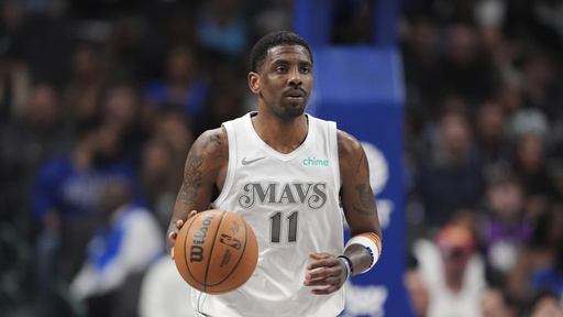 FILE - Dallas Mavericks guard Kyrie Irving advances the ball up court during an NBA basketball game against the Milwaukee Bucks in Dallas, Saturday, March 1, 2025. (AP Photo/Tony Gutierrez,File)