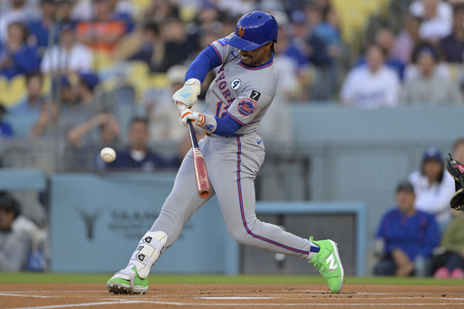 New York Mets' Francisco Lindor hits a solo home run in the first inning of a baseball game against the Los Angeles Dodgers, Monday, June 2, 2025, in Los Angeles. (AP Photo/Jayne Kamin-Oncea)