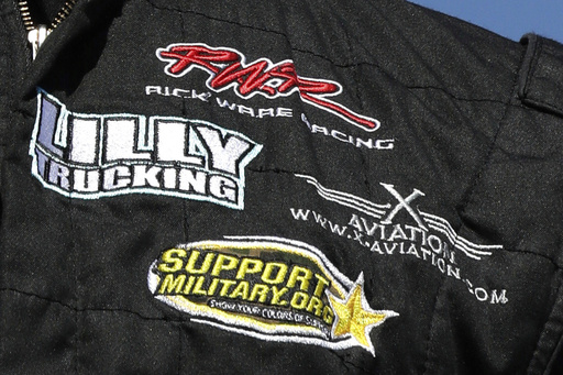 FILE - A Rick Ware Racing patch is displayed on the fire suit of driver Cody Ware prior to the NASCAR Cup Series 300 auto race at New Hampshire Motor Speedway in Loudon, N.H., Sunday, Sept. 24, 2017. (AP Photo/Charles Krupa, File)
