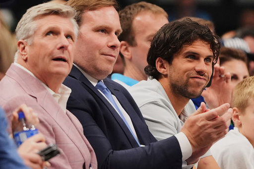 FILE - Dallas Mavericks CEO Rick Welts, left, and team Governor Patrick Dumont, center, watch the team play against the Toronto Raptors in the first half of an NBA basketball game in Dallas, April 11, 2025. (AP Photo/LM Otero, file)