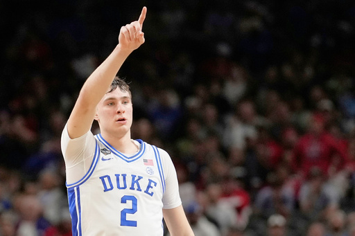 FILE - Duke forward Cooper Flagg celebrates after scoring against the Houston during the second half in the national semifinals at the Final Four of the NCAA college basketball tournament, Saturday, April 5, 2025, in San Antonio. (AP Photo/Brynn Anderson, File)