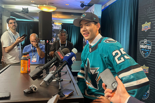 Simon Wang speaks to the media after the San Jose Sharks selected the defenseman with the 33rd overall pick in the NHL draft in Los Angeles on Saturday, June 28, 2025. (AP Photo/Greg Beacham)