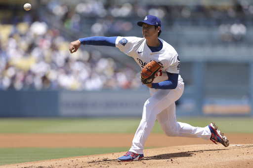 Los Angeles Dodgers starting pitcher Shohei Ohtani throws to a Washington Nationals batter during the first inning of a baseball game in Los Angeles, Sunday, June 22, 2025. (AP Photo/Jessie Alcheh)