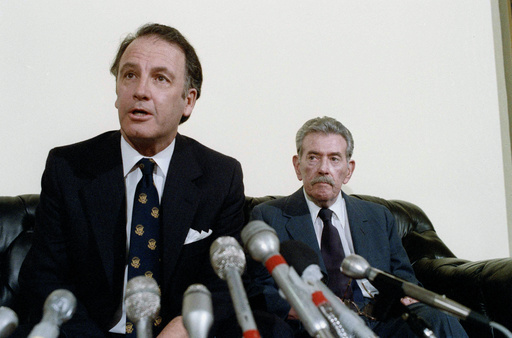 FILE - U.S. Rep. Pat Williams, (D-Mont), left, fields questions while seated next to Col. Murray Sanders during a news conference on Japanese World War II germ warfare experiments on American POW's on Capitol Hill in Washington, Dec. 6, 1985. (AP Photo/John Duricka, File)