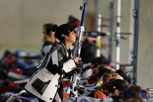 FILE - Yarimar Mercado Martinez, of Puerto Rico, competes during the women's 50-meter Rifle 3 Positions qualification, at the Olympic Shooting Center, during the 2016 Summer Olympics in Rio de Janeiro, Brazil on Aug. 11, 2016. (AP Photo/Hassan Ammar, File)