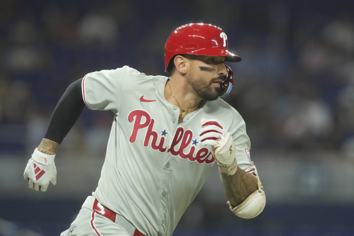 Philadelphia Phillies' Nick Castellanos runs after hitting a double during the seventh inning of a baseball game against the Miami Marlins, Wednesday, June 18, 2025, in Miami. (AP Photo/Marta Lavandier)