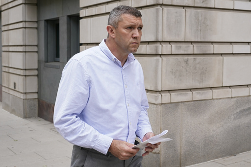 FILE - Washington Metropolitan Police Department Lt. Shane Lamond departs federal court after pleading not guilty to obstruction of justice and other charges, May 19, 2023, in Washington. (AP Photo/Patrick Semansky, File)