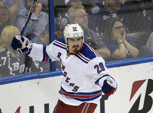 FILE - New York Rangers' Chris Kreider celebrates after scoring a goal during the second period of Game 4 of the Eastern Conference finals against the Tampa Bay Lightning, in the NHL hockey Stanley Cup playoffs, May 22, 2015, in Tampa, Fla. (AP Photo/Phelan M. Ebenhack, file)