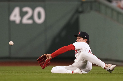Boston Red Sox outfielder Roman Anthony makes the catch on a fly out by Tampa Bay Rays' Jonathan Aranda during the sixth inning of a baseball game at Fenway Park, Tuesday, June 10, 2025, in Boston. (AP Photo/Charles Krupa)