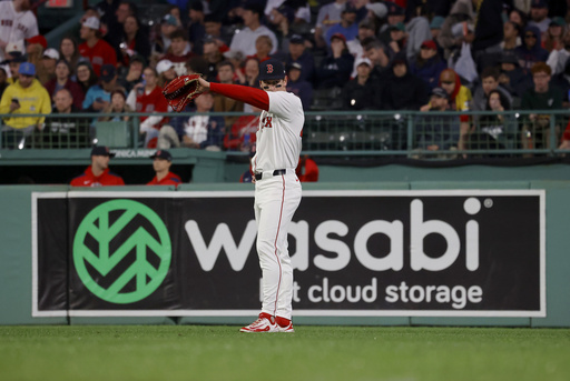 Boston Red Sox right fielder Roman Anthony reacts after committing a fielding error on a line drive from Tampa Bay Rays batter Yandy Díaz during the fifth inning of a baseball game at Fenway Park, Monday, June 9, 2025, in Boston. (AP Photo/Mary Schwalm)