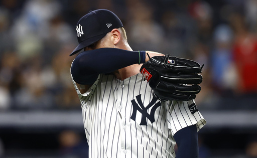 New York Yankees pitcher Ian Hamilton reacts on his way to the dugout during the ninth inning of a baseball game against the Boston Red Sox, Saturday, June 7, 2025, in New York. (AP Photo/Noah K. Murray)