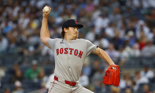 Boston Red Sox pitcher Hunter Dobbins (73) throws against the New York Yankees during the first inning of a baseball game, Sunday, June 8, 2025, in New York. (AP Photo/Noah K. Murray)