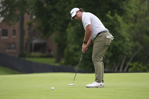 Aldrich Potgieter, of South Africa, putts on the eighth hole during the first round of the Rocket Classic golf tournament at the Detroit Golf Club, Thursday, June 26, 2025, in Detroit. (AP Photo/Paul Sancya)