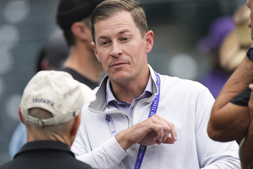 Walker Monfort, who was named as executive vice president of the Colorado Rockies Thursday, June 25, 2025, and will assume the role of president and chief operating officer at season's end, talks to fans before a baseball game Wednesday, June 25, 2025, in Denver. (AP Photo/David Zalubowski)