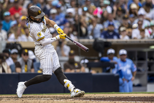 San Diego Padres' Fernando Tatis Jr. hits a home run in the seventh inning of a baseball game against the Kansas City Royals, Saturday, June 21, 2025, in San Diego. (AP Photo/Tony Ding)