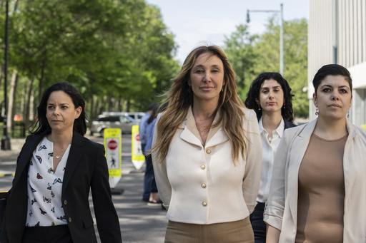 FILE - Nicole Daedone, center, founder and former CEO of OneTaste, departs Brooklyn federal court on Tuesday, June 13, 2023 in New York. (AP Photo/Jeenah Moon, File)