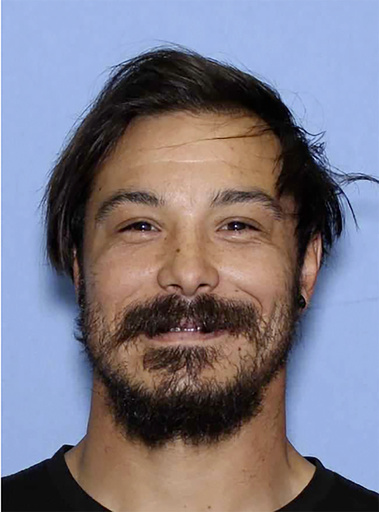 This undated photo provided by the Wenatchee Police Department shows Travis Caleb Decker who the police are asking the public for help in locating the Washington state father who is wanted for murder after his three young daughters were reported missing and then found dead. (Wenatchee Police Department via AP)