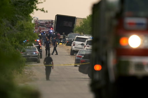 FILE - Body bags lie at the scene where a tractor trailer with multiple dead bodies was discovered, Monday, June 27, 2022, in San Antonio. (AP Photo/Eric Gay,File)