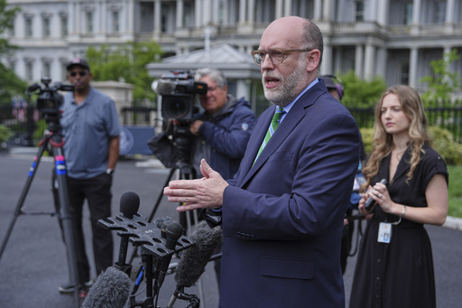 Office of Management and Budget director Russell Vought speaks to reporters at the White House, Thursday, May 22, 2025, in Washington. (AP Photo/Evan Vucci)