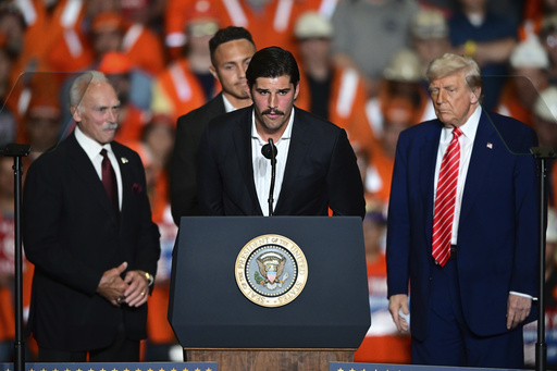 Pittsburgh Steelers quarterback Mason Rudolph speeks as former Pittsburgh Steelers Rocky Bleier and Pittsburgh Steelers safety Miles Killebrew listen at the U.S. Steel Mon Valley Works-Irvin plant, Friday, May 30, 2025, in West Mifflin, Pa. (AP Photo/David Dermer)