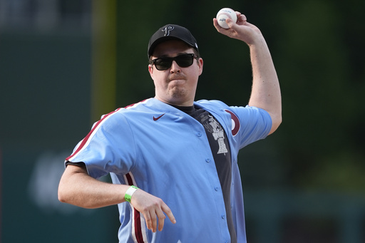 FILE - Comedian Shane Gillis throws out a pitch before a baseball game between the Philadelphia Phillies and the Texas Rangers, Wednesday, May 22, 2024, in Philadelphia. (AP Photo/Matt Slocum, File)