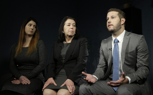 FILE - Christine Levinson, center, wife of Robert Levinson, and her children, Dan Levinson, right, and Samantha Levinson talk to reporters in New York, Jan. 18, 2016. (AP Photo/Seth Wenig, File)