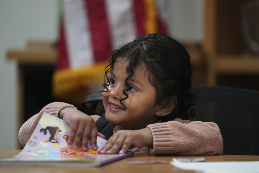 A 4-year-old Mexican girl, who has short bowel syndrome, attends a news conference in Los Angeles, Wednesday, May 28, 2025, after her and her mother's humanitarian parole was terminated and they were ordered to self-deport. (AP Photo/Jae C. Hong)