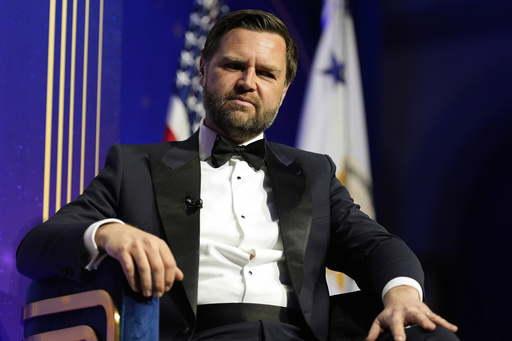 Vice President JD Vance listens as he speaks with American Compass founder Oren Cass at the American Compass's The New World Gala in Washington, Tuesday, June 3, 2025. (AP Photo/Mark Schiefelbein)