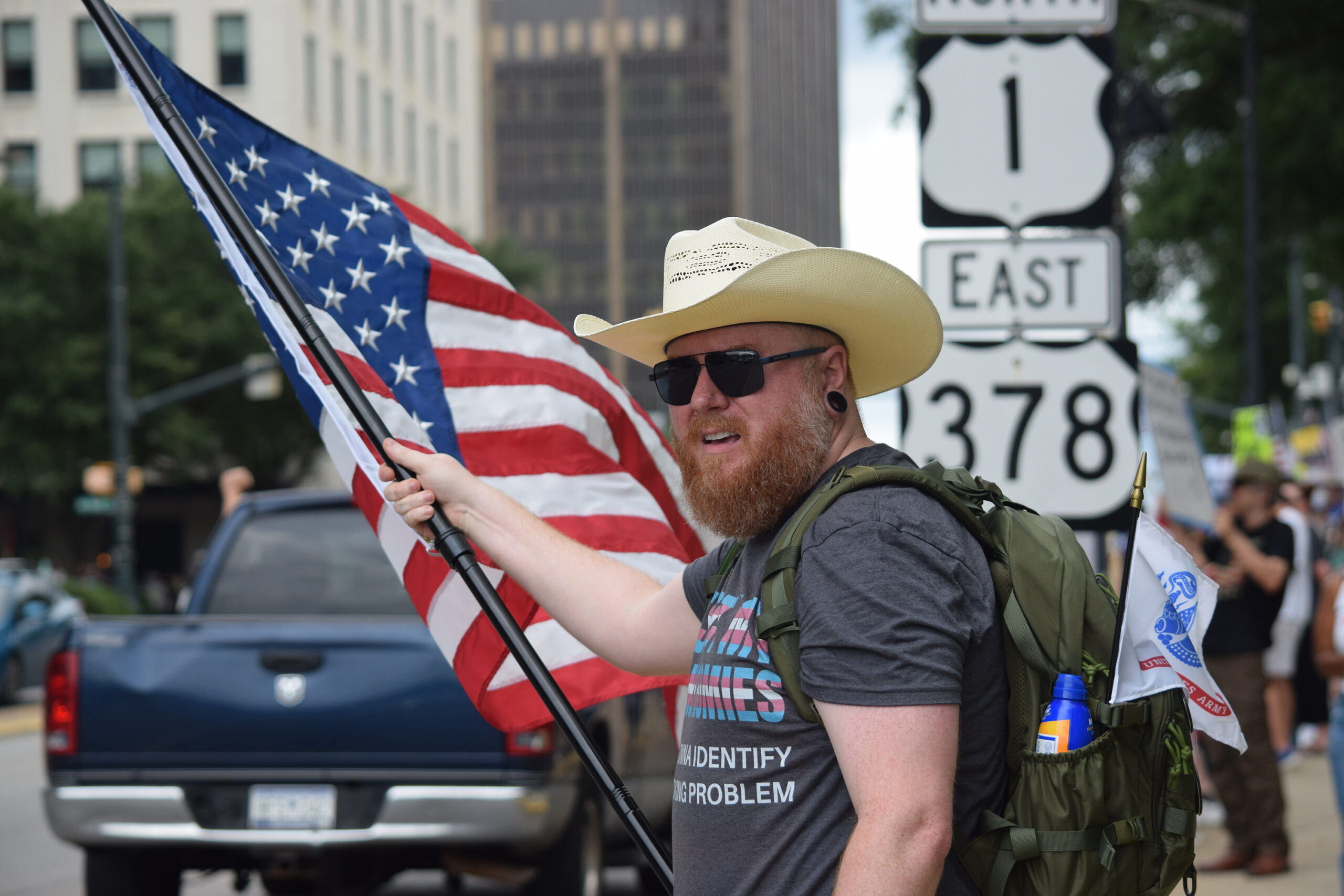 Kevin Brown, a 41-year-old business owner from Columbia, South Carolina, waves to vehicles passing in front of the Statehouse on Saturday, June 14, 2025, during a No Kings protest event.