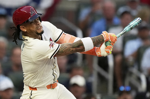 Arizona Diamondbacks' Ketel Marte watches his two run double in the first at the MLB baseball All-Star game between the American League and National League, Tuesday, July 15, 2025, in Atlanta. (AP Photo/Brynn Anderson)