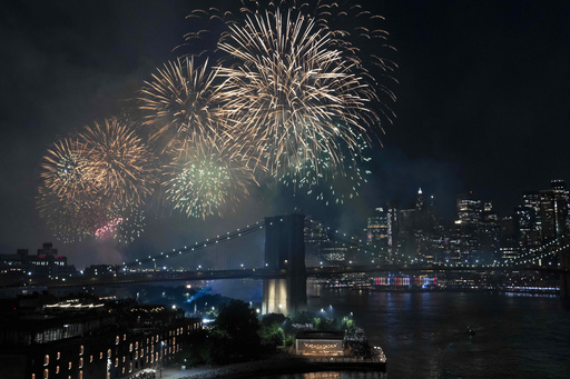 Fireworks light up the sky above the Brooklyn Bridge during the Macy's Fourth of July fireworks show on Friday, July 4, 2025, in New York. (AP Photo/Yuki Iwamura)