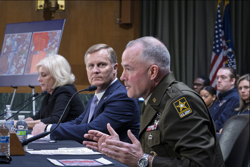 FILE - Brig. Gen. Matthew Braman, director of Army Aviation, center, answers questions, joined from left by Jennifer Homendy, chair of the National Transportation Safety Board, and Chris Rocheleau, acting administrator of the Federal Aviation Administration, as the Senate Transportation Subcommittee holds a hearing to examine the preliminary report by the National Transportation Safety Board on the Jan. 29, 2025, midair collision of an Army Black Hawk helicopter and an American Airlines regional jet, on Capitol Hill in Washington, March 27, 2025. (AP Photo/J. Scott Applewhite, File)