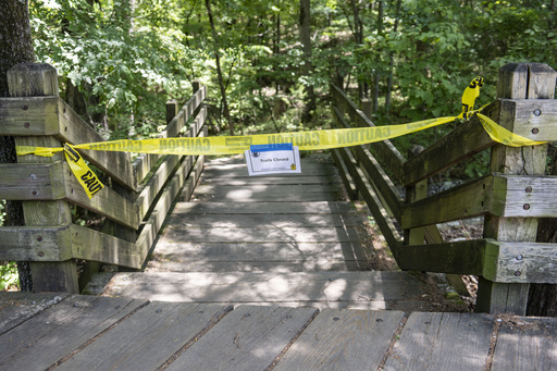 The trail head to the Devil's Den trail at Devils Den State Park remains closed Monday, July 28, 2025, in West Fork, Ark. Police in Arkansas are searching for a suspect in the deaths of a couple who investigators said were attacked while on the wooded walking trail with their two young daughters. (AP Photo/Michael Woods)