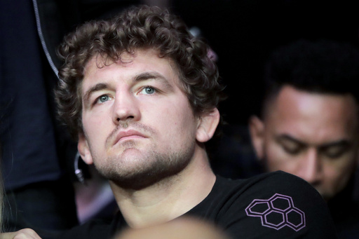 FILE - UFC fighter Ben Askren waits for the start of a middleweight mixed martial arts bout between David Branch and Jared Cannonier at UFC 230, in New York, Nov. 3, 2018. (AP Photo/Julio Cortez, File)