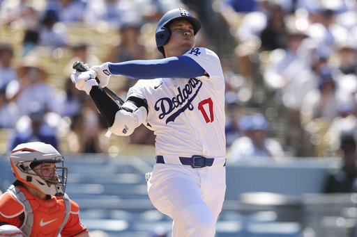 Los Angeles Dodgers designated hitter Shohei Ohtani swings during the eighth inning of a baseball game against the Houston Astros, Sunday, July 6, 2025, in Los Angeles. (AP Photo/Jessie Alcheh)