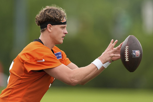 FILE - Cincinnati Bengals quarterback Joe Burrow catches a ball during NFL football practice on Tuesday, May 13, 2025, in Cincinnati. (AP Photo/Carolyn Kaster, File)