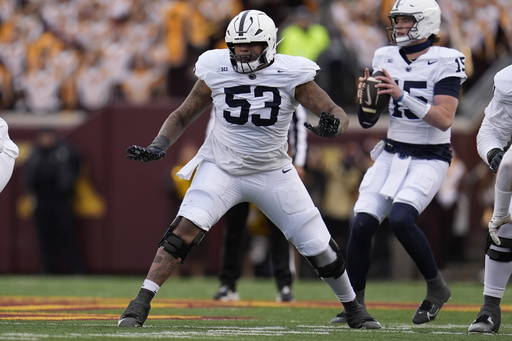 FILE - Penn State offensive lineman Nick Dawkins (53) in action during the first half of an NCAA college football game against Minnesota, Nov. 23, 2024, in Minneapolis. (AP Photo/Abbie Parr, File)