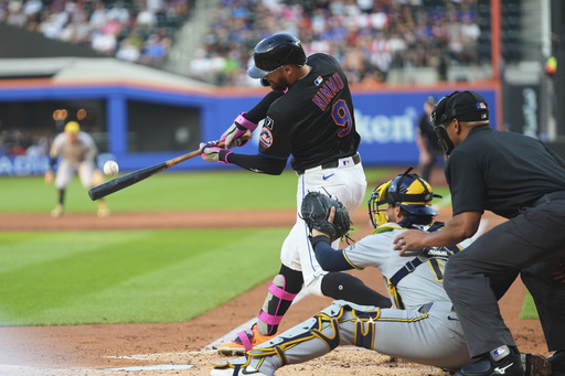 New York Mets' Brandon Nimmo (9) hits a grand slam during the second inning in the second baseball game of a doubleheader against the Milwaukee Brewers Wednesday, July 2, 2025, in New York. (AP Photo/Frank Franklin II)