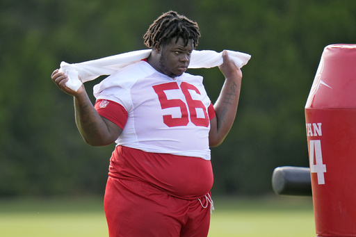 Tampa Bay Buccaneers defensive tackle Desmond Watson watches from the sideline during practice at NFL football training camp, Wednesday, July 23, 2025, in Tampa, Fla. (AP Photo/Chris O'Meara)