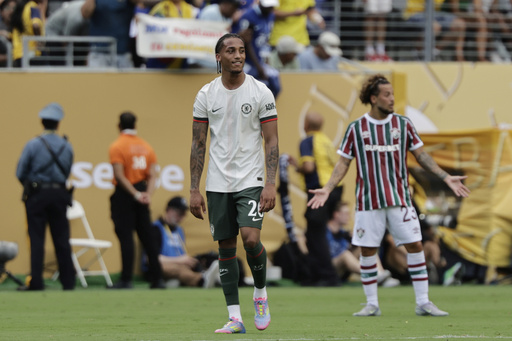 Chelsea's Joao Pedro reacts after scoring his side's opening goal during the Club World Cup semifinal soccer match between Fluminense and Chelsea in East Rutherford, N.J., Tuesday, July 8, 2025. (AP Photo/Adam Hunger)