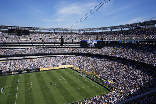 Players and fans observe a minute of silent in memory of Portugal international and Liverpool player Diogo Jota and his brother Andre Silva prior the Club World Cup quarterfinal soccer match between Real Madrid and Borussia Dortmund in East Rutherford, N.J., Saturday, July 5, 2025. (AP Photo/Pamela Smith)
