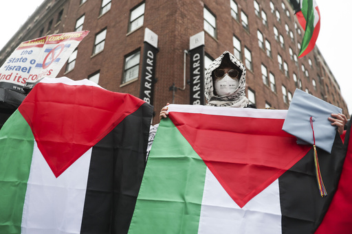 FILE - Protesters gather in support of Palestinians across the street from the main gates of Columbia University, May 21, 2025, in New York. (AP Photo/Heather Khalifa, File)