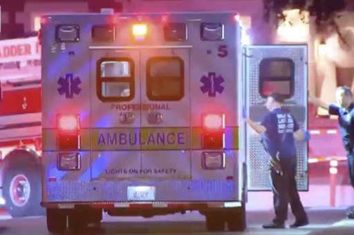 In this still image taken from video, and ambulance with working lights is parked in a street in Cambridge, Mass., on Wednesday, July 23, 2025. (AP Photo)