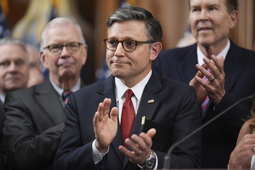 Speaker of the House Mike Johnson, R-La., is seen with other Republican House members after the passage of President Donald Trump's signature bill of tax breaks and spending cuts, at the Capitol in Washington, Thursday, July 3, 2025. (AP Photo/J. Scott Applewhite)