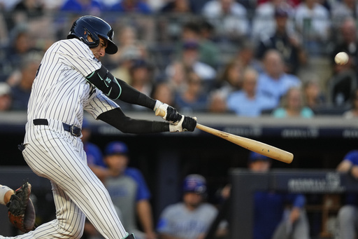 New York Yankees' Cody Bellinger hits a home run during the third inning of a baseball game against the Chicago Cubs, Friday, July 11, 2025, in New York. (AP Photo/Yuki Iwamura)