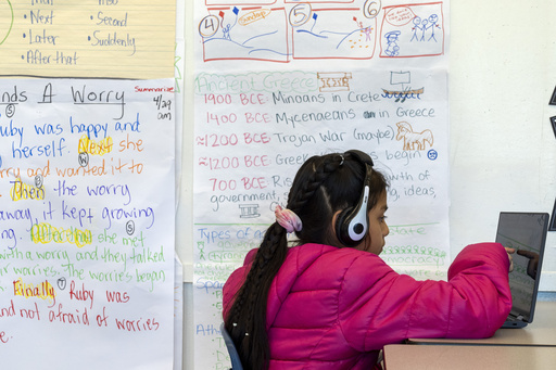 FILE - Jaelene, 9, works on a computer during a third grade English language arts class at Mount Vernon Community School, in Alexandria, Va., May 1, 2024. (AP Photo/Jacquelyn Martin, File)