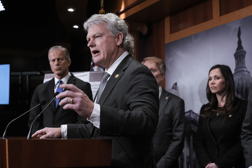 FILE - Rep. Mike Collins, R-Ga., center,, is joined from left by Senate Majority Leader John Thune, R-S.D., Sen. James Lankford, R-Okla., and Sen. Katie Britt, R-Ala., as they talk to reporters about the Laken Riley Act, a bill to detain unauthorized immigrants who have been accused of certain crimes, at the Capitol in Washington, Jan. 9, 2025. (AP Photo/J. Scott Applewhite, File)