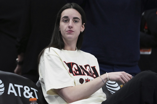 Indiana Fever guard Caitlin Clark looks on before a WNBA basketball game against the Chicago Sky, Sunday, July 27, 2025, in Chicago. (AP Photo/Nam Y. Huh)