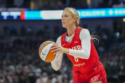 Indiana Fever guard Sophie Cunningham prepares to shoot against the Dallas Wings during the first half of a WNBA basketball game Friday, June 27, 2025, in Dallas. (AP Photo/Julio Cortez)